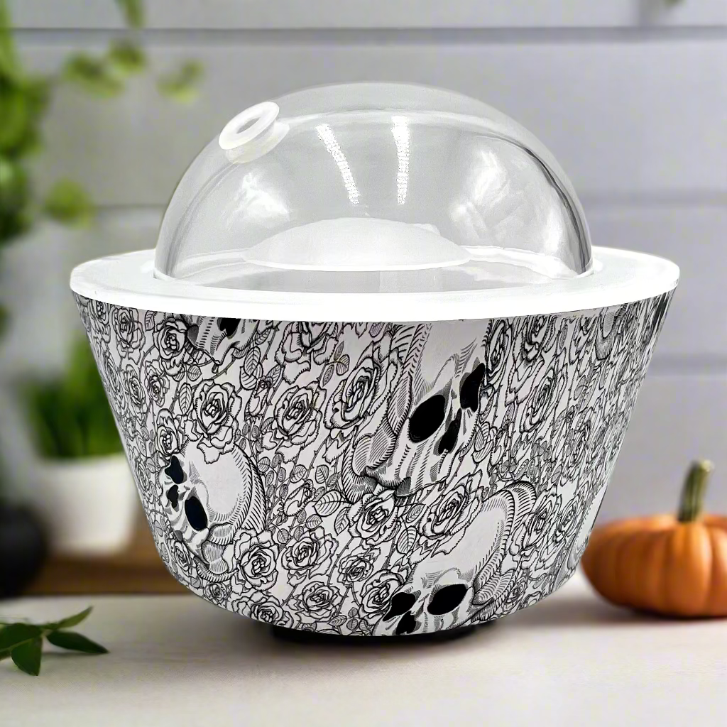 Decorative bowl with black and white skull and rose pattern on a white background
