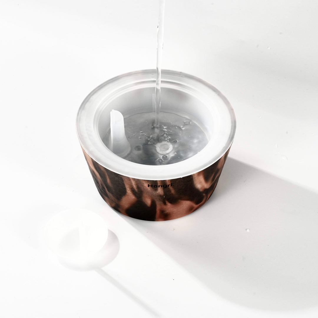 Close-up of the Flame Diffuser, emitting a gentle glow, with natural materials reflecting the elegance of the design.