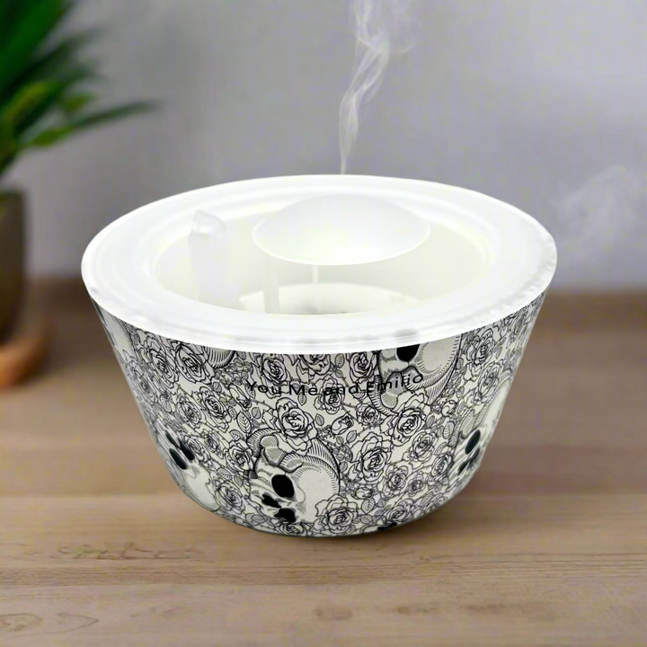Candle in a decorative container with black and white design on a white background. add a lot of mist. 