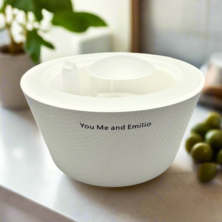 White mixing bowl with 'You Me and Emilio' text on a white background