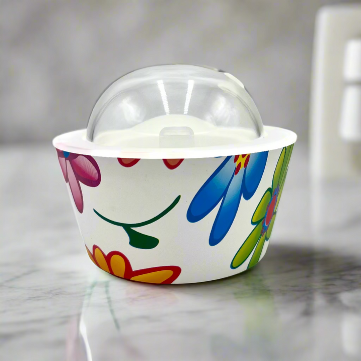 Colorful floral-patterned ice cream container with a clear lid on a white background