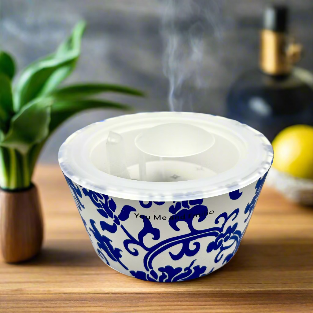 Blue and white patterned pet bowl on a white background