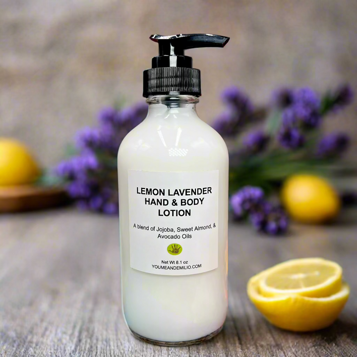 Lemon Lavender Hand & Body Lotion on a marble countertop surrounded by fresh lemons and lavender sprigs.
