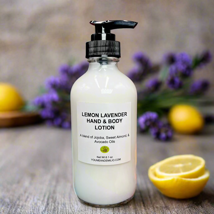 Lemon Lavender Hand & Body Lotion on a marble countertop surrounded by fresh lemons and lavender sprigs.