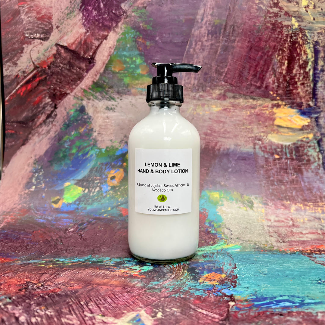 Lemon & Lime Hand & Body Lotion on a wooden tray with natural ingredients like Jojoba, Sweet Almond, and Avocado oils.