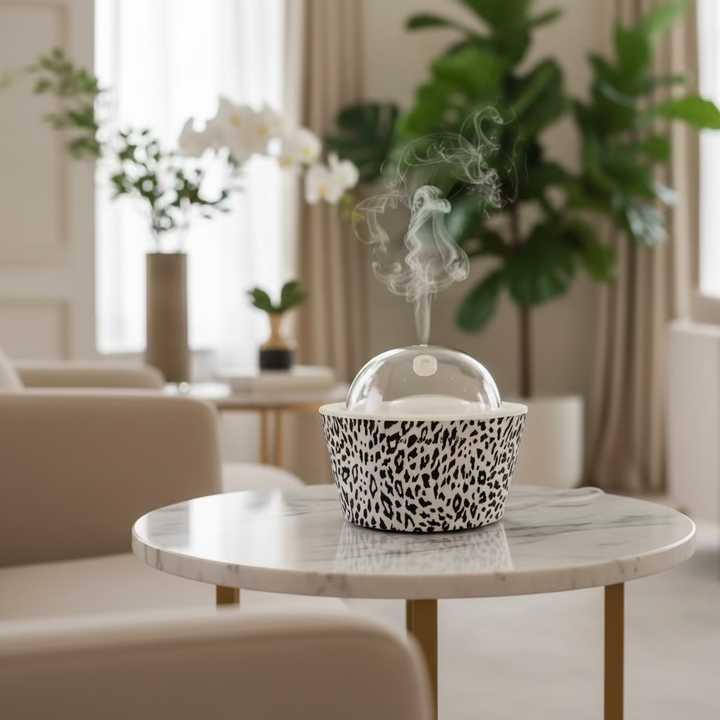 Container with leopard print design and clear dome lid on a white background