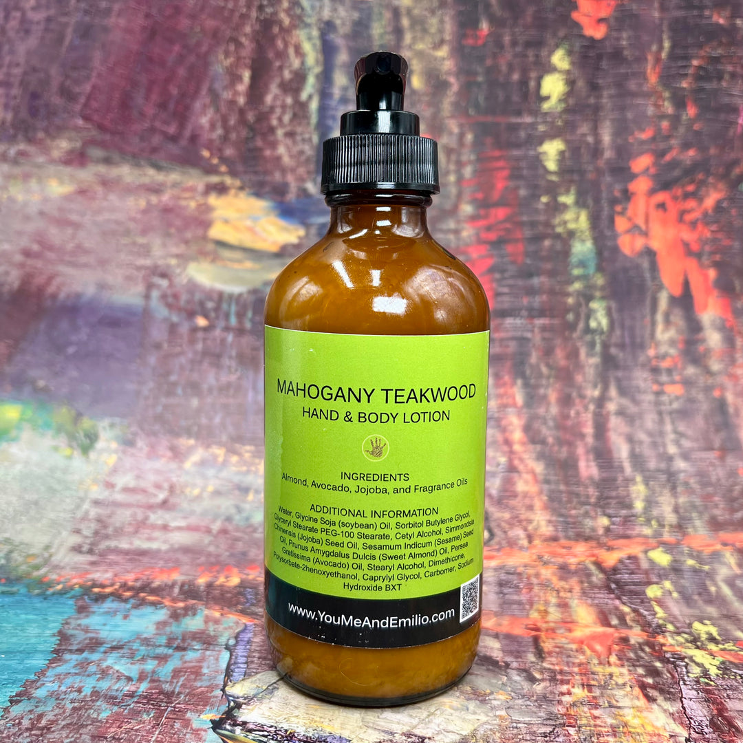 Flat lay of Mahogany Teakwood Hand & Body Lotion, nestled on a rustic wooden table with sprigs of geranium and lavender, reflecting its soothing and sophisticated fragrance.