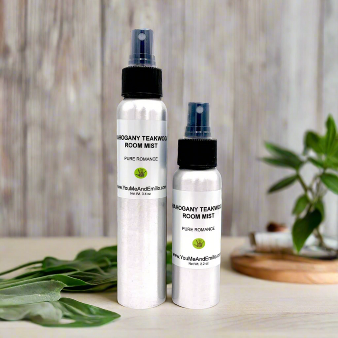 A flat lay of the Mahogany Teakwood Room Mist bottle next to eco-friendly decor, like reusable fabric and sustainable candles, emphasizing its commitment to quality and mindful living.
