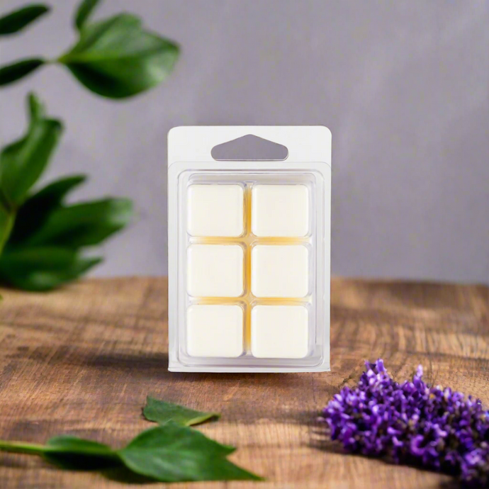 A set of Mahogany Teakwood Soy Wax Melts displayed alongside natural elements like mahogany wood, cedar wood, and lavender sprigs, highlighting the luxurious and earthy inspiration behind the fragrance.