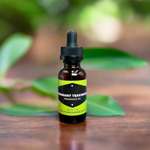 Mahogany Teakwood Fragrance Oil displayed against a backdrop of polished wood and greenery, reflecting its bold and refined scent profile.