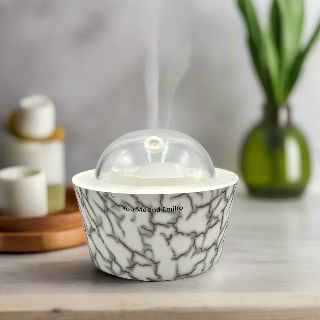Marble-patterned container with a clear dome lid on a white background