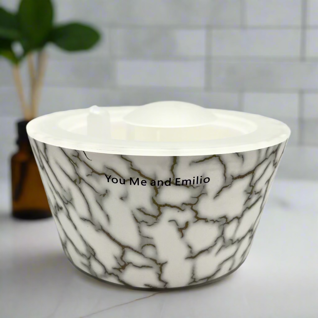 Marble-patterned bowl with 'You Me and Emilio' text on a white background