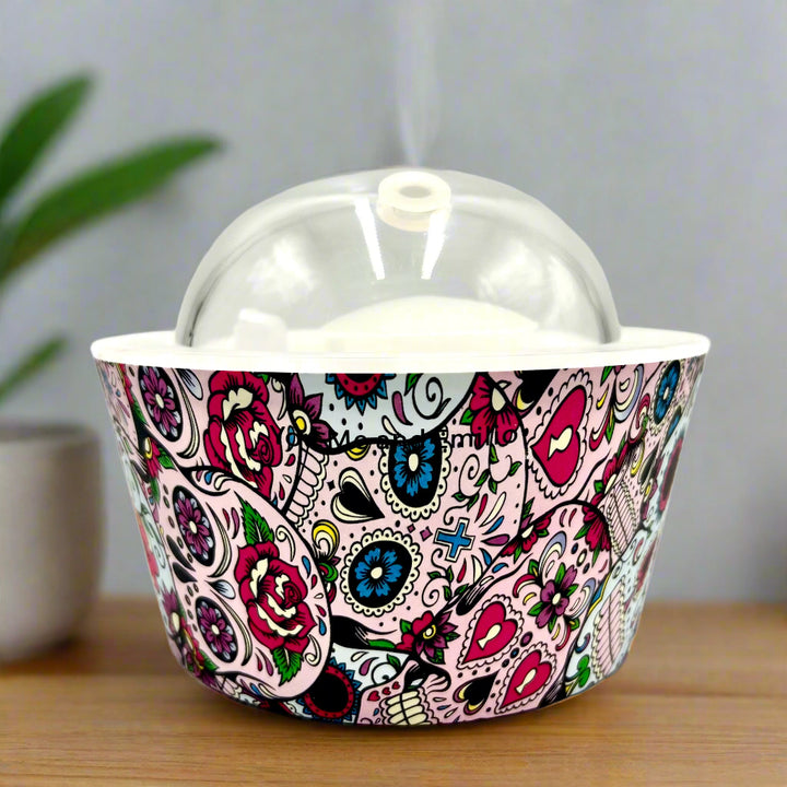 Bring calm and elegance to your space with our Day Of The Dead Catrina Oil Diffuser. Ultrasonic mist, 10-hour runtime & auto shut-off. Shop YOU ME & EMILIO.