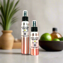 A stylish frosted glass bottle of Mystic Myrrh Room Mist with a sleek black spray nozzle, offering an instant burst of earthy, mystical fragrance for any room.
