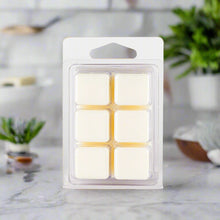 A set of Mystic Myrrh Soy Wax Melts in a clear clamshell packaging, showcasing the smooth, richly colored wax cubes ready to fill your space with a deep, aromatic scent.