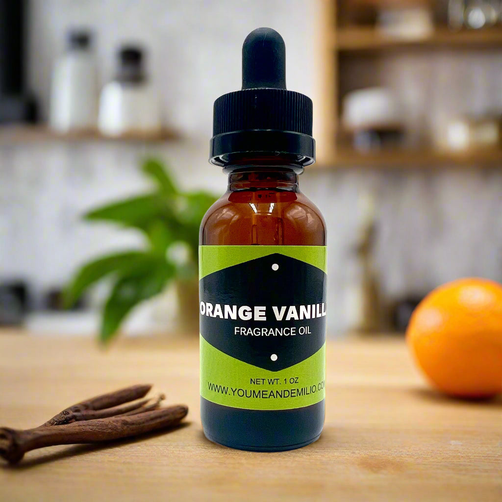 Bottle of orange vanilla fragrance oil with a dropper on a white background