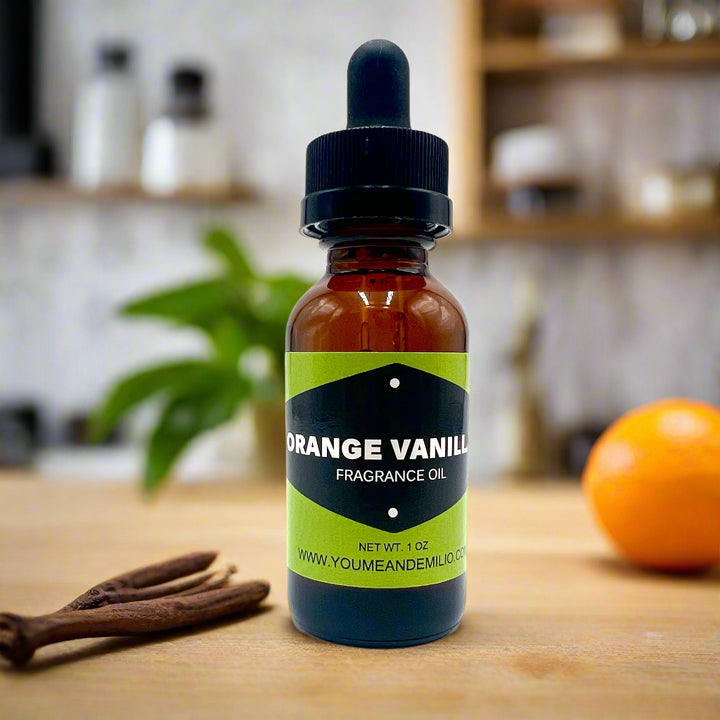 Bottle of orange vanilla fragrance oil with a dropper on a white background