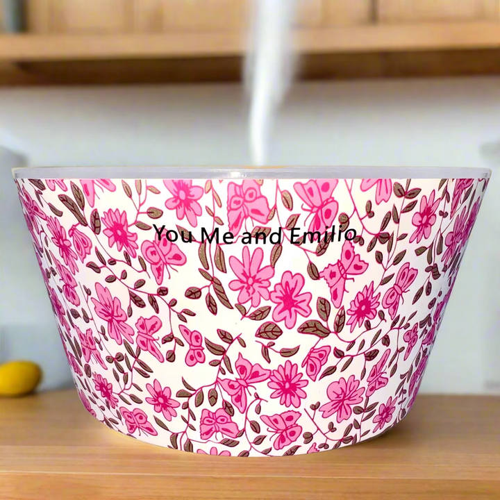 Decorative container with pink floral pattern and 'You Me and Emilio' branding on a white background.