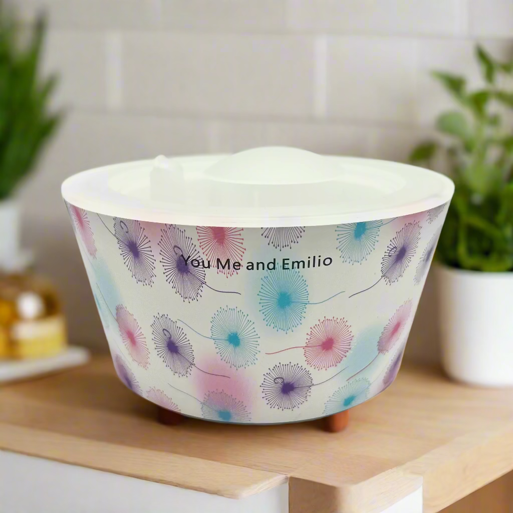 White bowl with floral pattern and 'You Me and Emilio' text on a white background