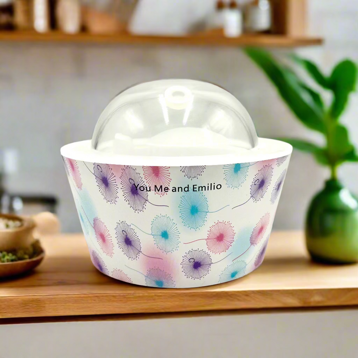 Decorative container with floral pattern and 'You Me and Emilio' text on a white background