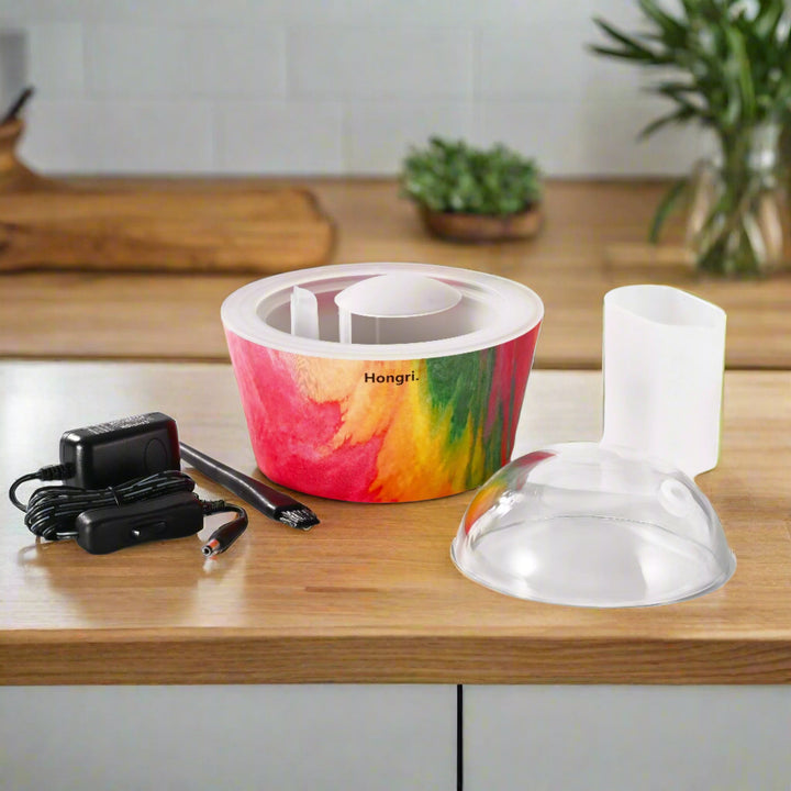 The Color Me Diffuser glowing with a colorful mist in an elegant and contemporary home decor setup.
