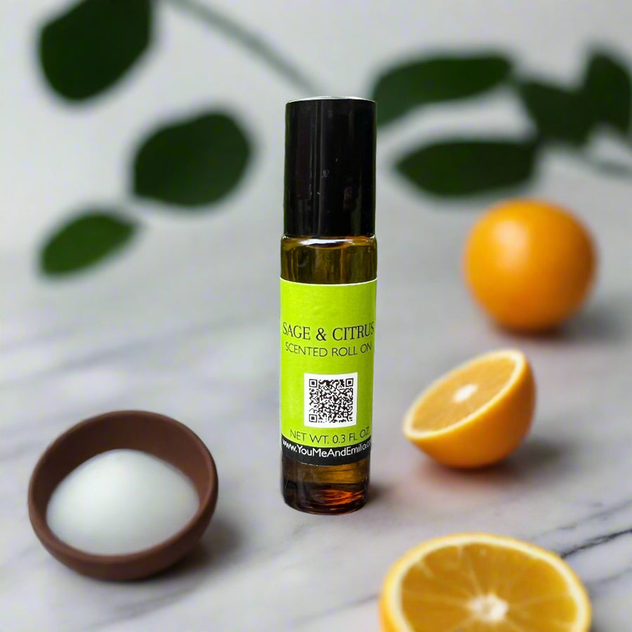 Sage & Citrus Scented Roll-On by You Me & Emilio in amber glass bottle, featuring fresh citrus and herbal sage fragrance oil for aromatherapy and self-care.