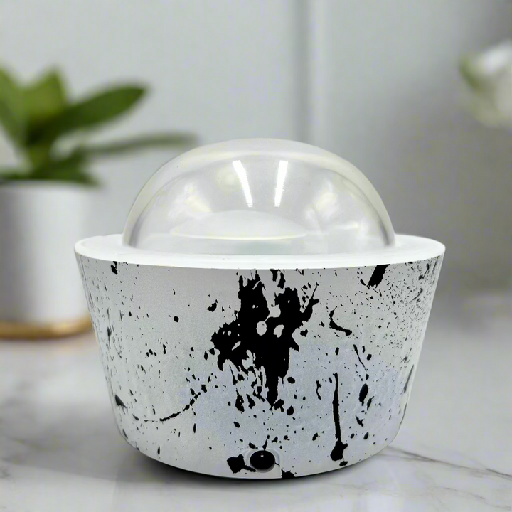 White bowl with black abstract design on a white background