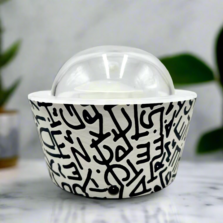 Plastic bowl with black abstract pattern on a white background
