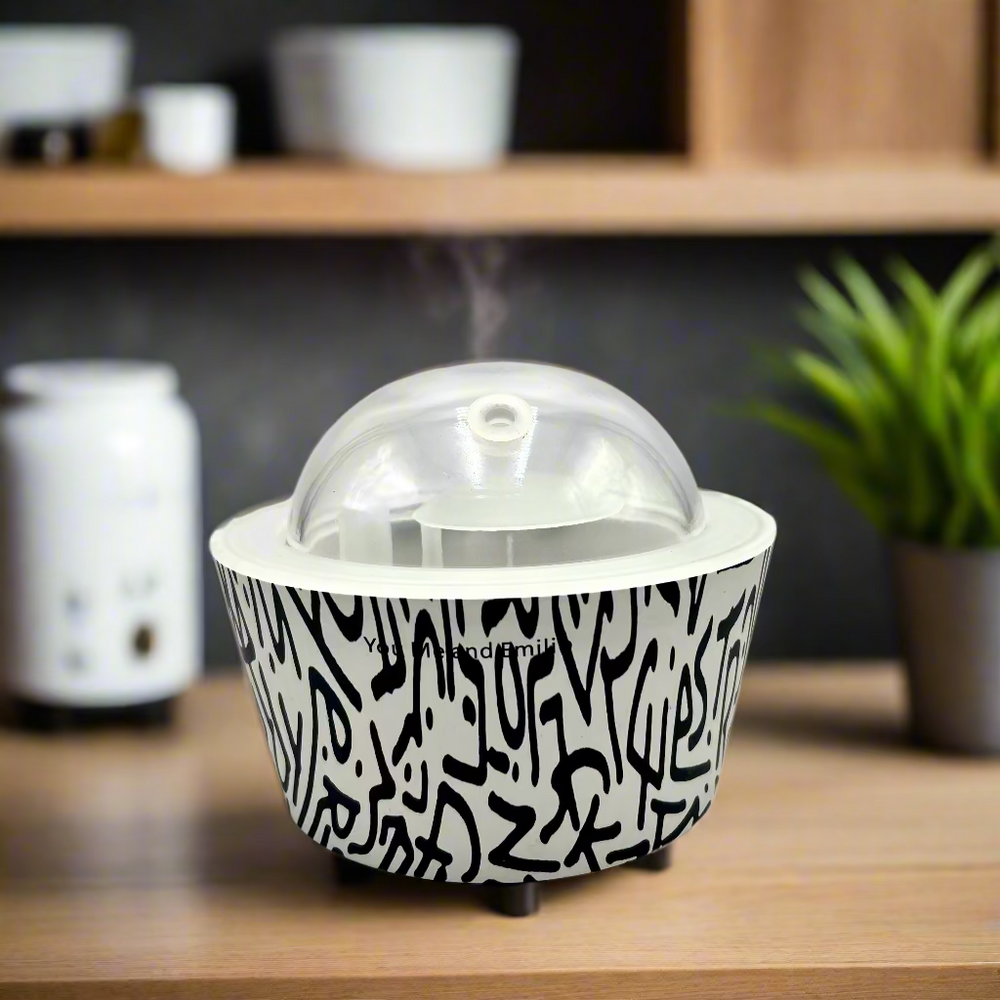 Black and white patterned container with a clear dome lid on a white background