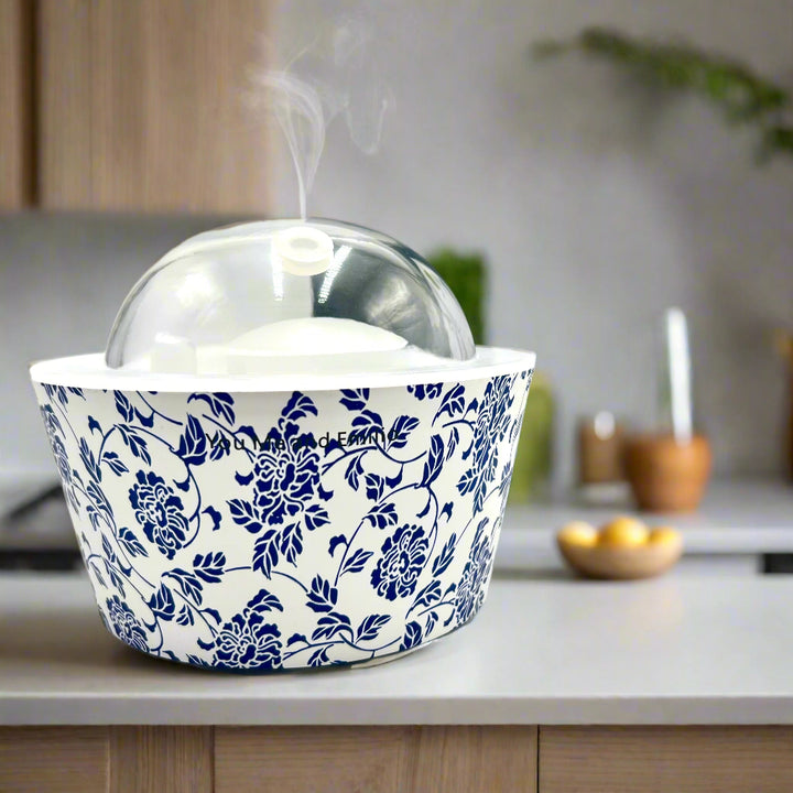 Serene Bouquet Oil Diffuser – A Symphony of Flowers and Flowing Water

Introducing the Serene Bouquet Oil Diffuser, a breathtaking new addition to the YOU ME &amp; EMILIO Diffuser Collection. Designed by our CEO, Emilio Horton, this diffuser brings the calming essence of a blooming garden into your home or workspace. Inspired by the peaceful rhythm of running water and the beauty of fresh flowers, the Serene Bouquet Diffuser delivers an unparalleled aromatherapy experience