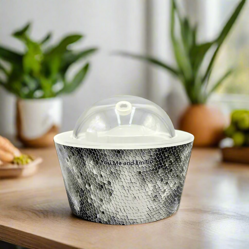 Decorative container with a textured design and glass dome on a white background