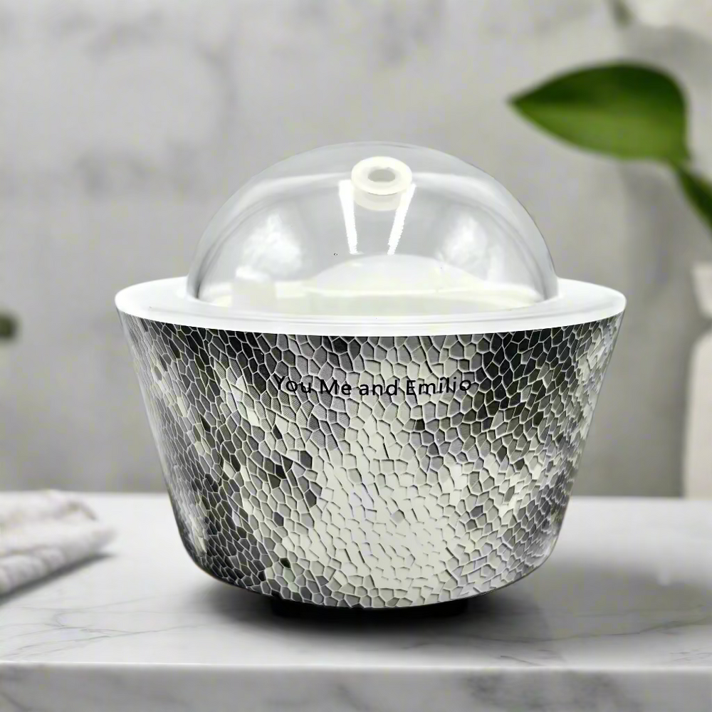 Silver textured container with a clear dome lid on a white background