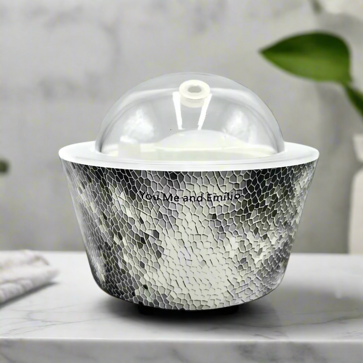 Silver textured container with a clear dome lid on a white background