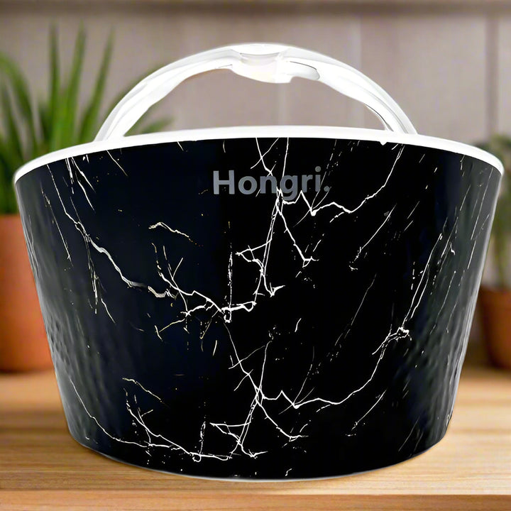 Elegant black oil diffuser named Stormy Night, styled on a wooden shelf with ambient lighting.