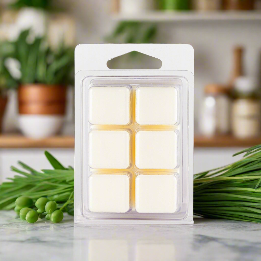 Pack of wax melts on a kitchen counter with plants in the background
