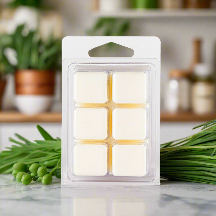 Pack of wax melts on a kitchen counter with plants in the background