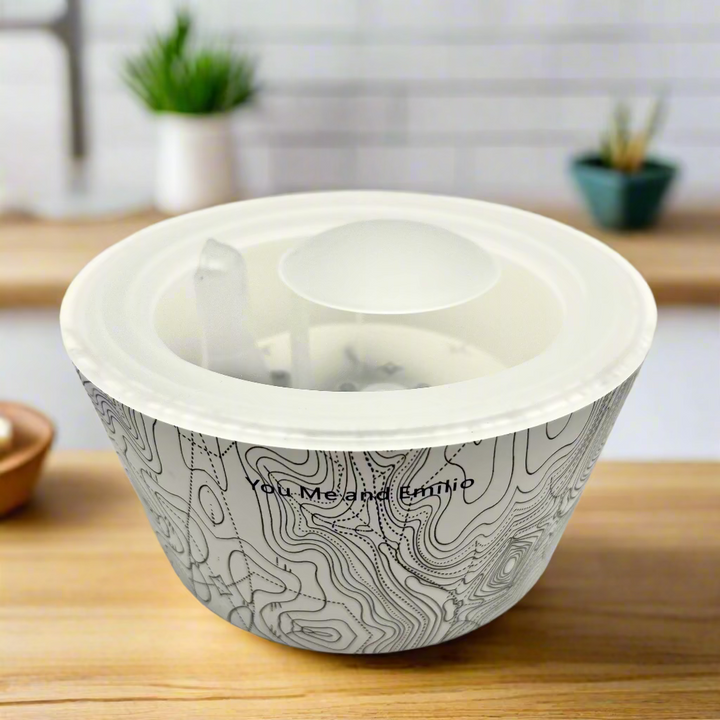 White bowl with black pattern and text on a white background