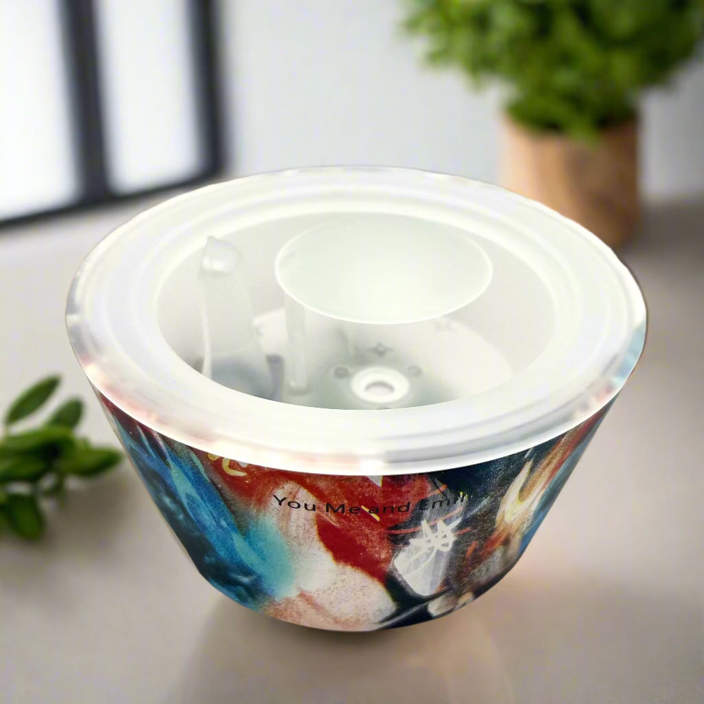 Colorful container with a clear lid on a white background