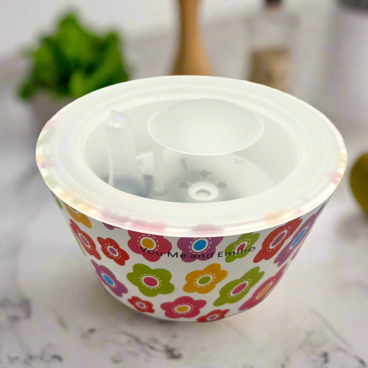 Small container with colorful floral pattern on a white background