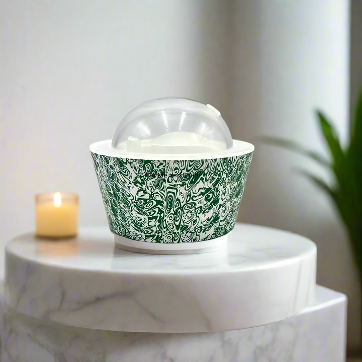 Green patterned container with a clear dome lid on a white background