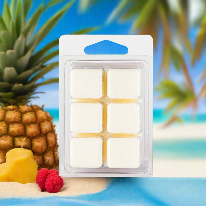 Tropical Escape Soy Wax Melts in a clear clamshell container with tropical fruits and driftwood, hand-poured and eco-friendly—ideal for summer and beach-inspired spaces.