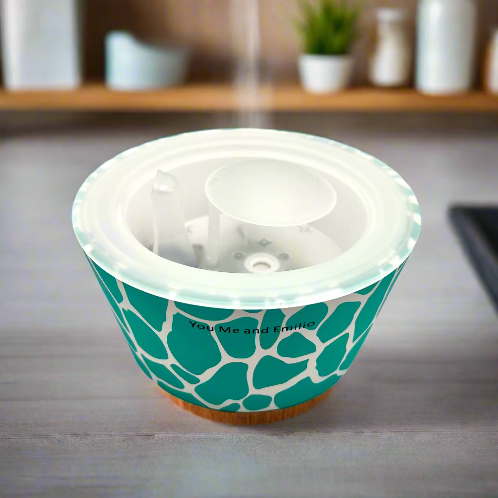 Teal patterned container with a white lid on a white background