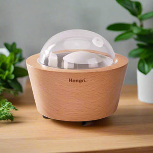 Elegant Wooden Essential Oil & Fragrance Oil Diffuser with a natural wood finish, inspired by the serene rivers of Eastern Europe. Designed for relaxation and ambiance, it features a 260ml water tank, up to 10 hours of operation, and an automatic shut-off for safety. Perfect for home or office aromatherapy.