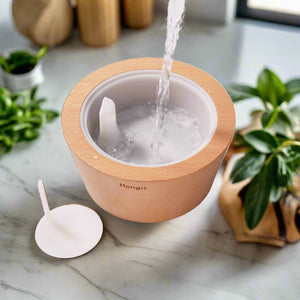 Experience the calming beauty of the Wooden Essential Oil & Fragrance Oil Diffuser, inspired by Eastern Europe’s natural landscapes. This stylish, efficient diffuser operates for up to 10 hours, filling your space with soothing scents while its wooden finish complements any decor.