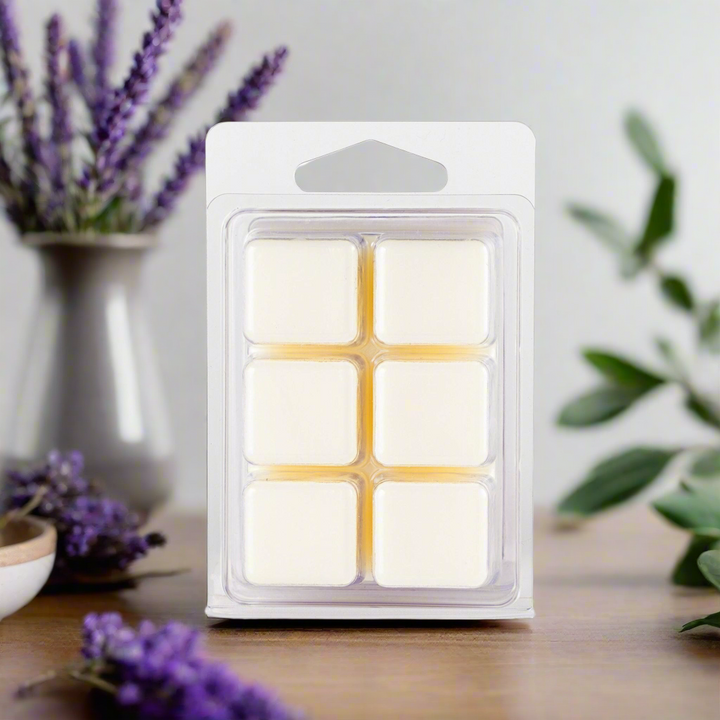 Pack of wax melts with lavender flowers in the background