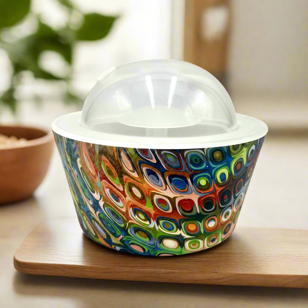 Colorful patterned container with a clear lid on a white background