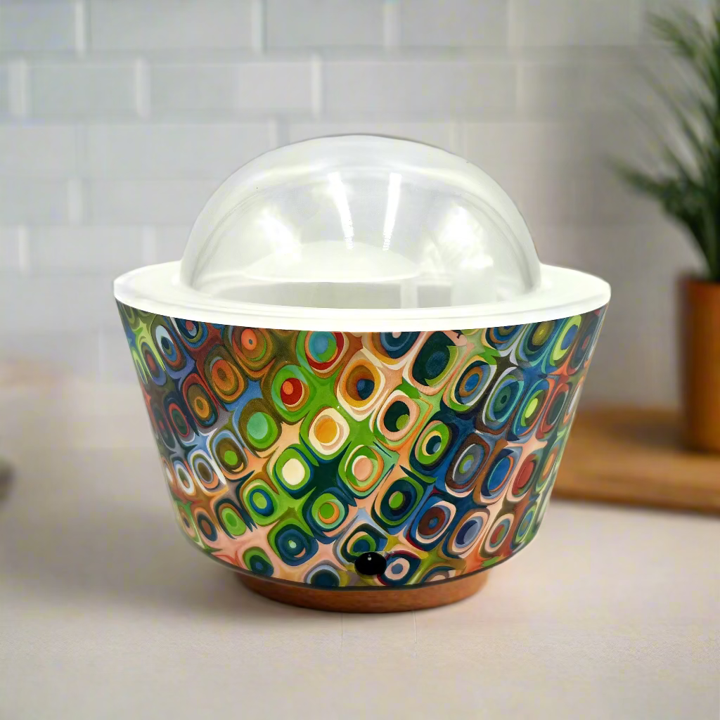 Colorful patterned bowl with a clear lid on a white background