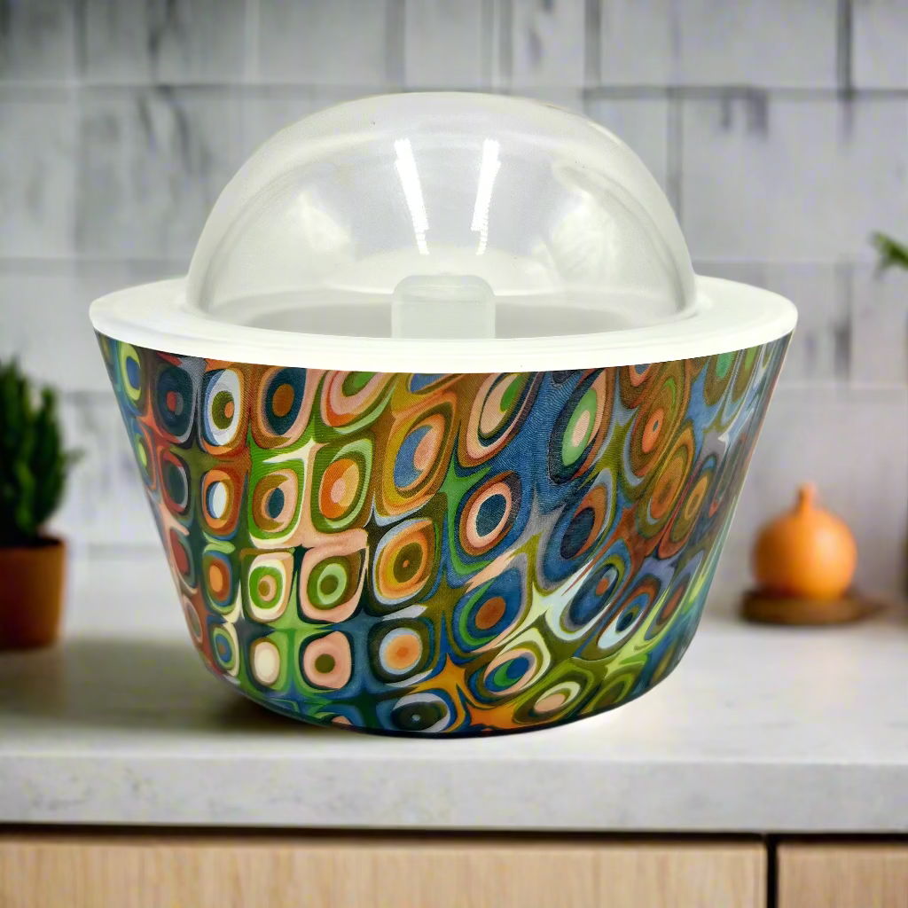 Colorful patterned bowl with a clear dome lid on a white background