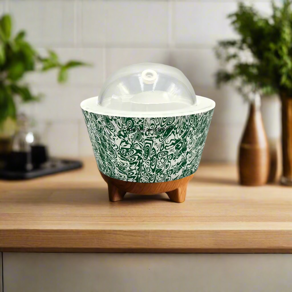 Decorative ceramic container with green pattern on a white background