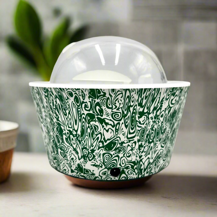 Ceramic bowl with green and white pattern on a white background